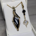 Pendentif Agate Tressage Artisanal Noir & Doré